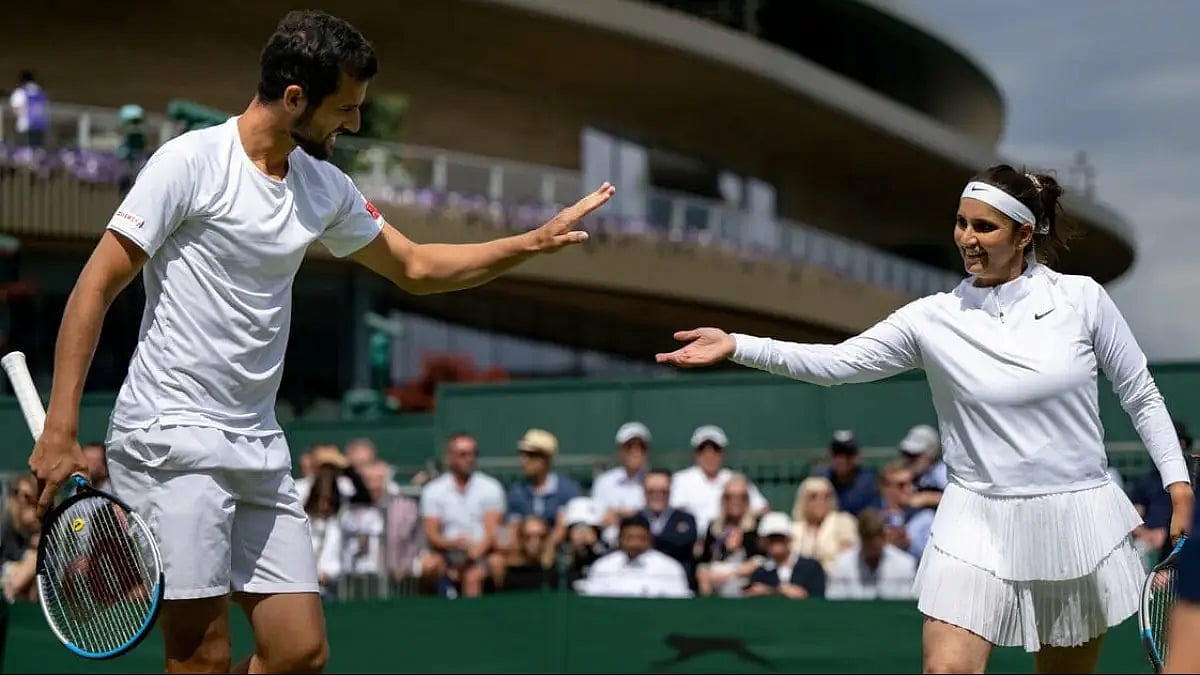 Sania Mirza and Mate Pavic during their Wimbledon 2022 first round mixed doubles match.