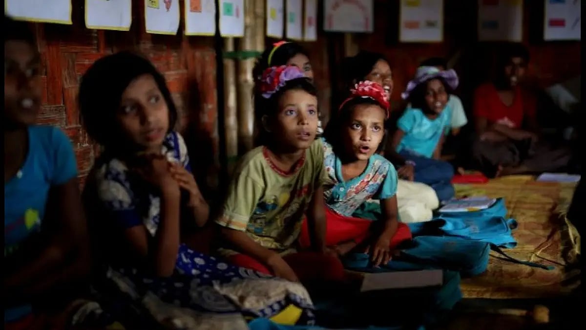 Rohingya children attend a UNICEF-run school in Balukhali refugee camp, Bangladesh.