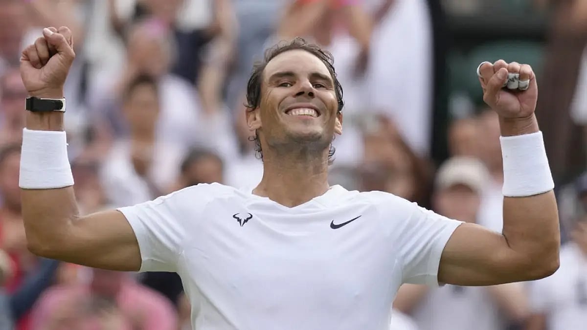 Rafael Nadal celebrates after beating Taylor Fritz in their men's singles quarterfinal match at Wimb
