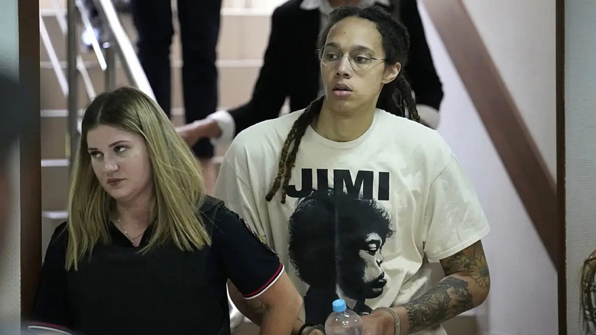 Brittney Griner, a two-time Olympic gold medalist, is escorted to a courtroom for a hearing, in Khimki, just outside Moscow, July 1, 2022.