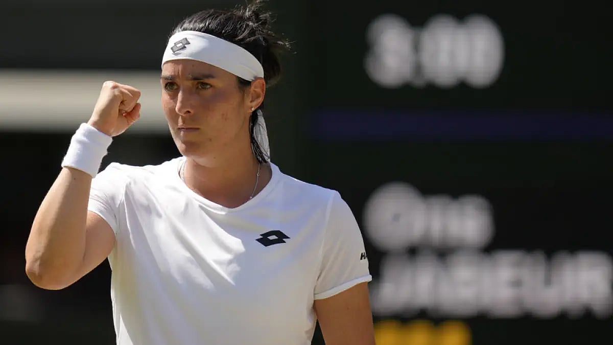 Ons Jabeur celebrates a point against Tatjana Maria during their ladies' singles semifinal at Wimbledon 2022.