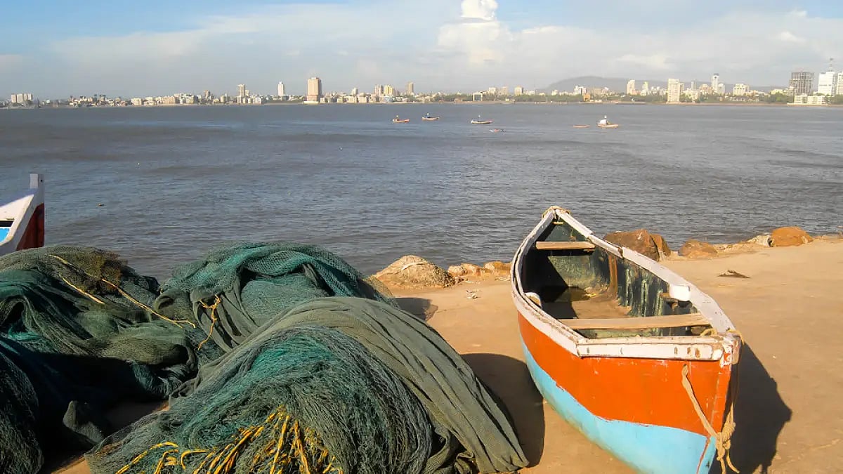 A fishing boat anchored on the shore at Worli village