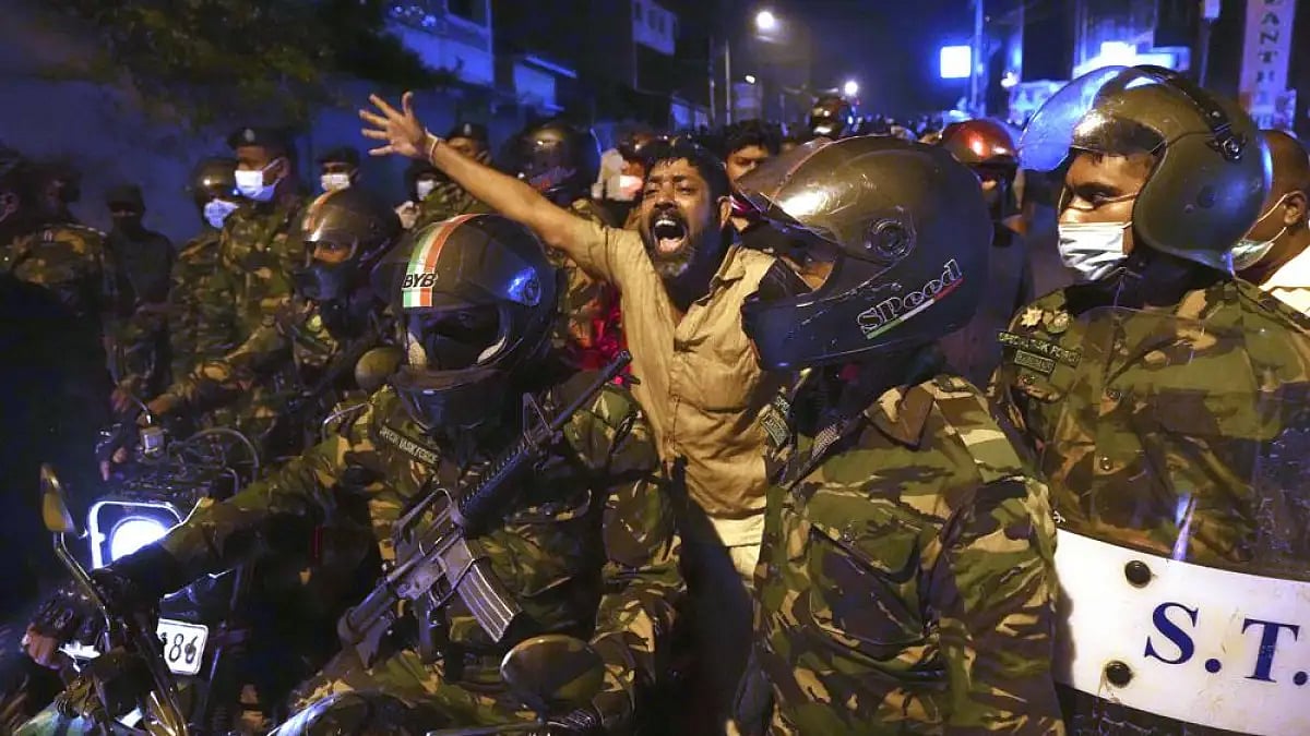 A Sri Lankan man shouts anti-government slogans during a protest outside the president's residence.