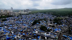 The sprawling Mumbai 'chawls' with posh, highrise buildings towering in the background