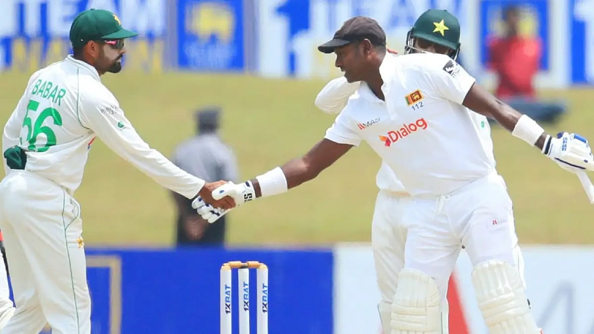 Pakistan captain Babar Azam congratulates Angelo Mathews on becoming the sixth Sri Lankan player to play 100 Test matches.