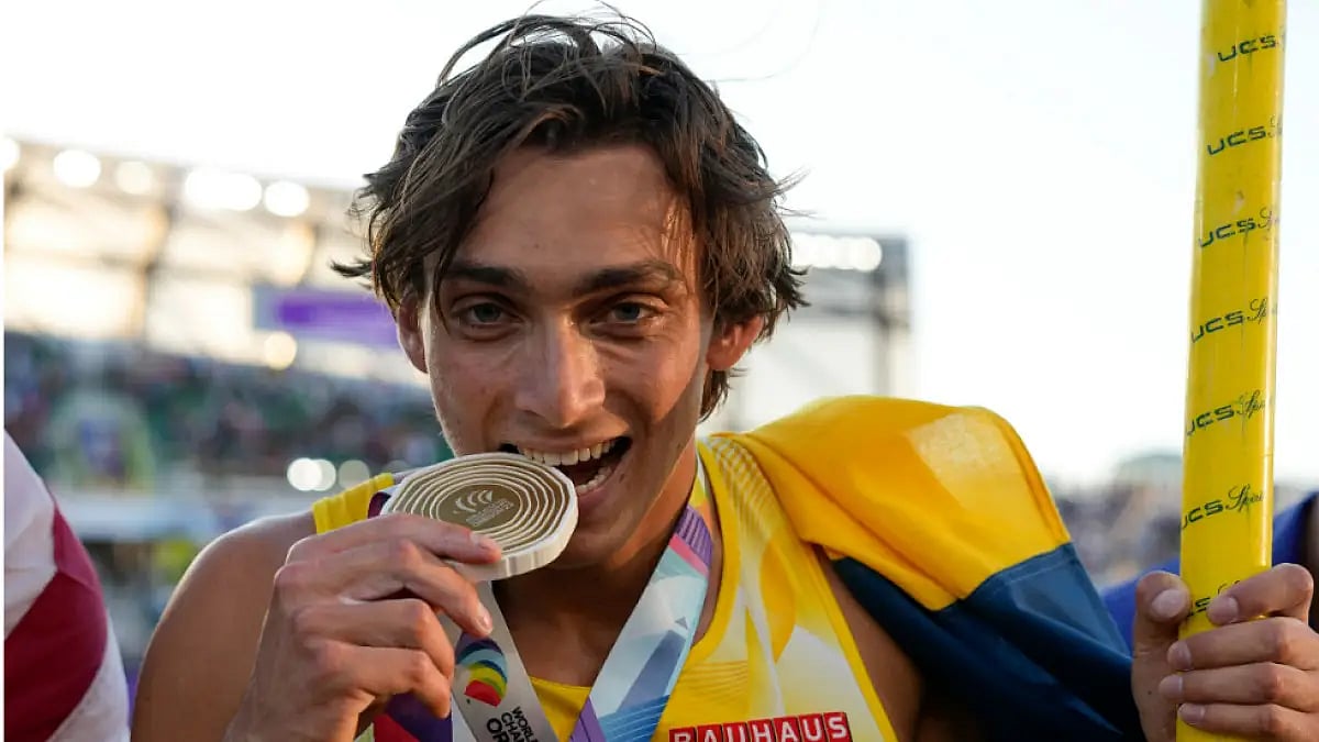 Armand Duplantis celebrates after setting a world record in the men's pole vault final in Eugene.