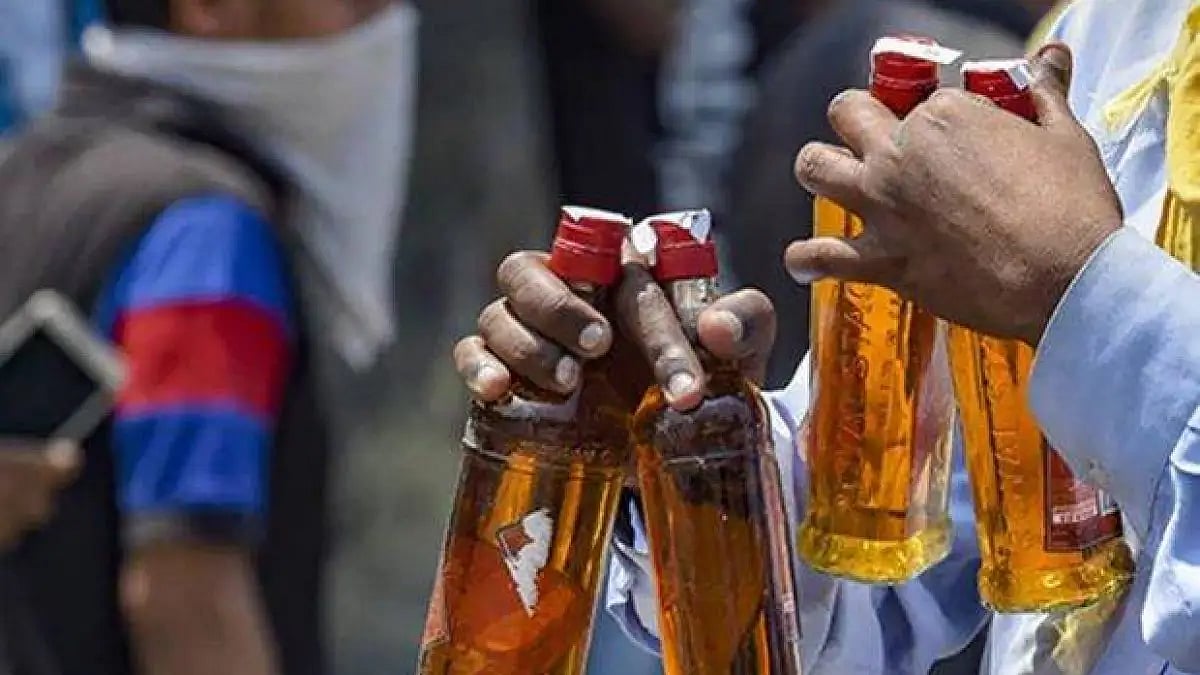 A man carrying a few bottles of liquor. (Representative image) 