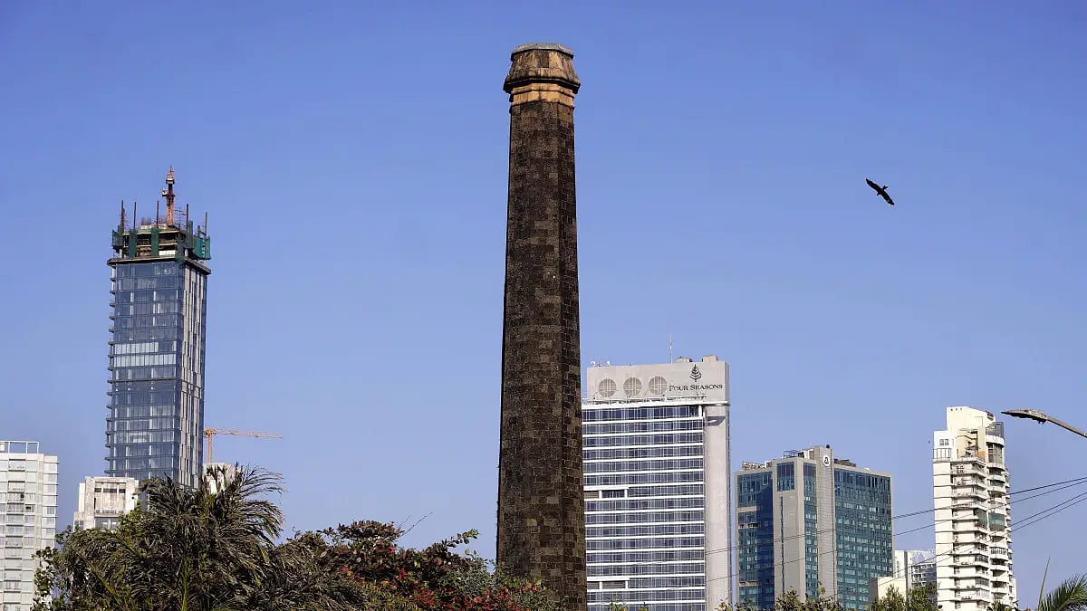 A view of a quaint mill in Mumbai in the backdrop of the urban cityscape 