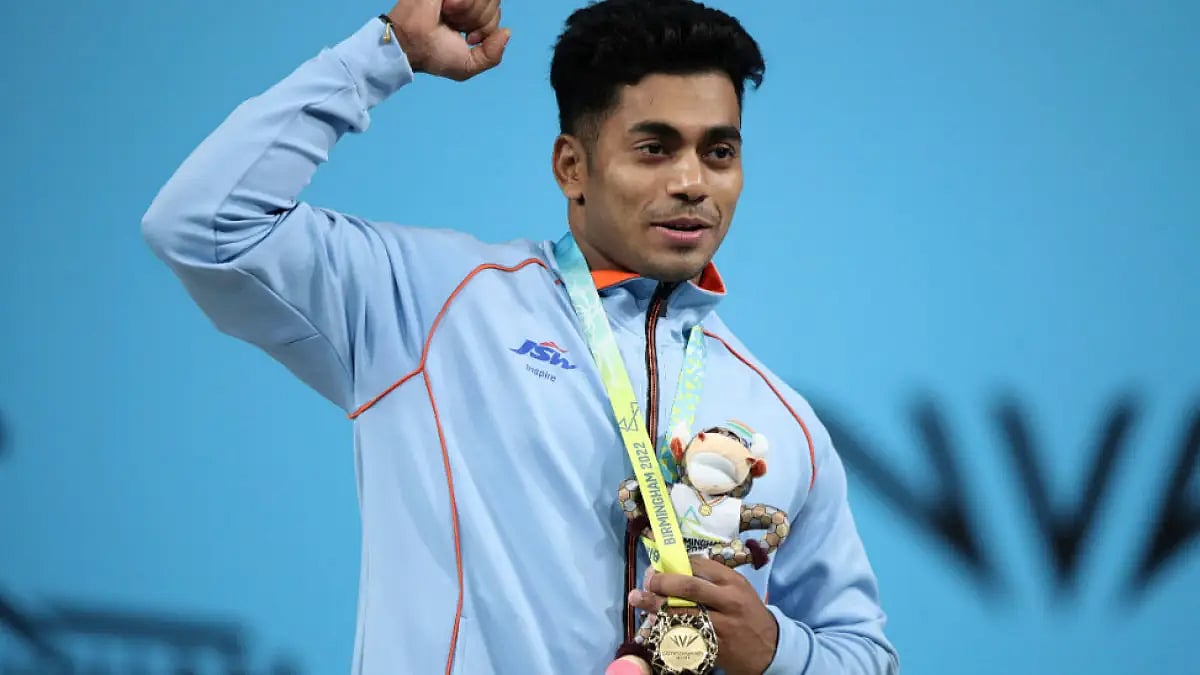 India's Achinta Sheuli celebrates after winning his Commonwealth Games 2022 gold medal. 