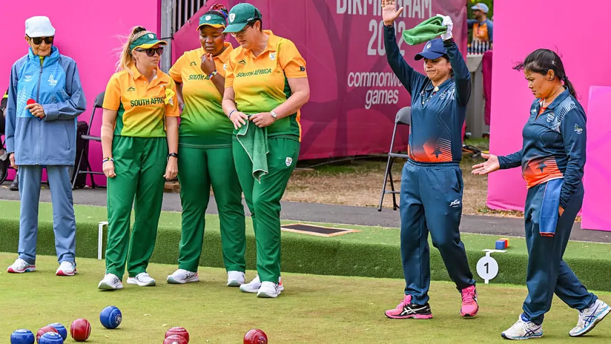 Indias's Nayanmoni Saikia and Pinki during the Lawn Bowls Women's Fours final against South Africa.