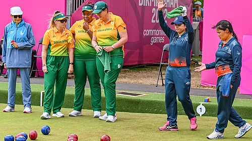 File : Indiass Nayanmoni Saikia and Pinki during the Lawn Bowls Womens Fours final against South Africa.