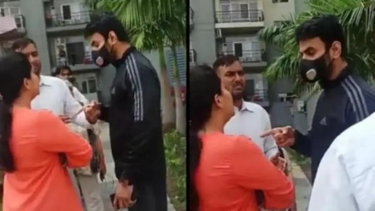 BJP leader (in black tracksuit) hurling abuses at a woman in Noida.