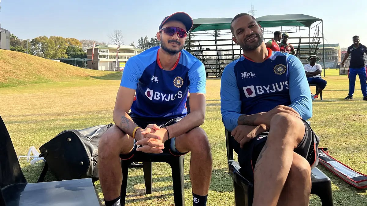 Shikhar Dhawan (R) shares a smile with Axar Patel during India's training session in Harare.  