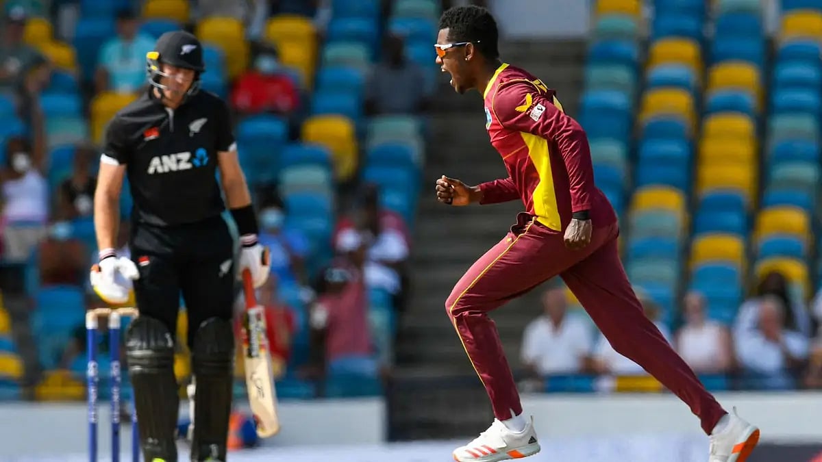 Akeal Hosein celebrates after taking a New Zealand wicket in the first ODI. 
