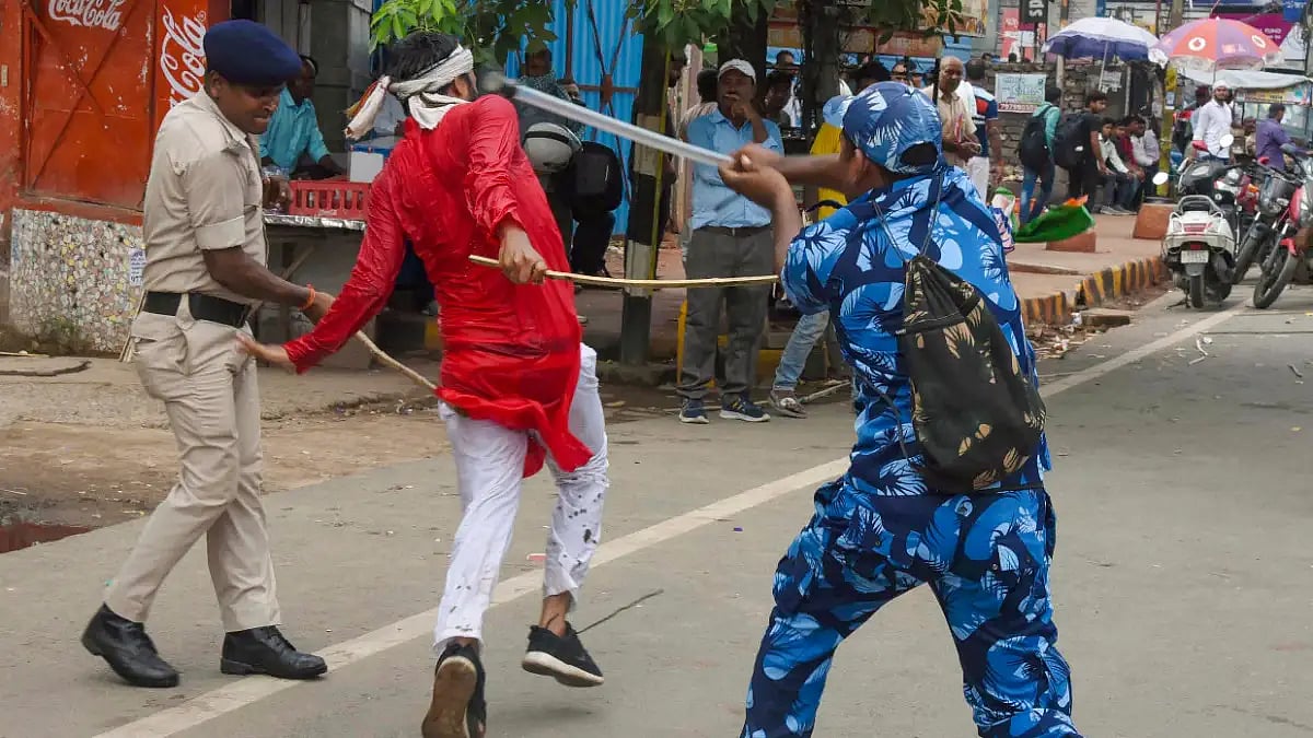 Security personnel baton charge to disperse protestors in Patna on Monday.