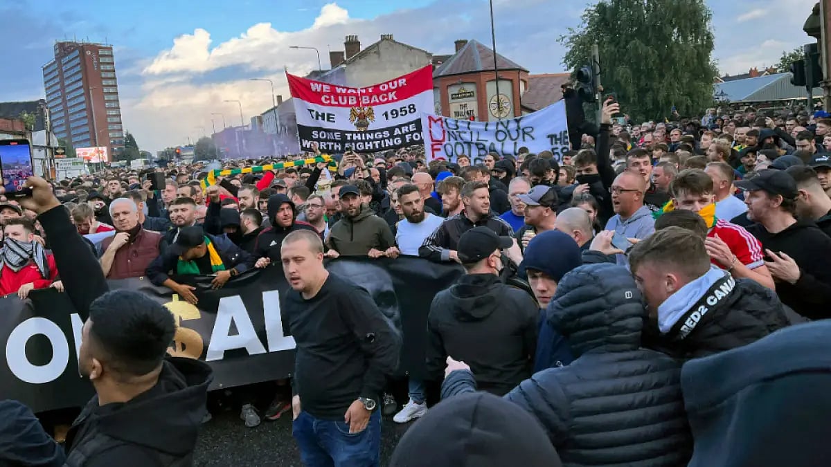 Manchester United fans protest ahead of their Premier League tie against Liverpool at Old Trafford.