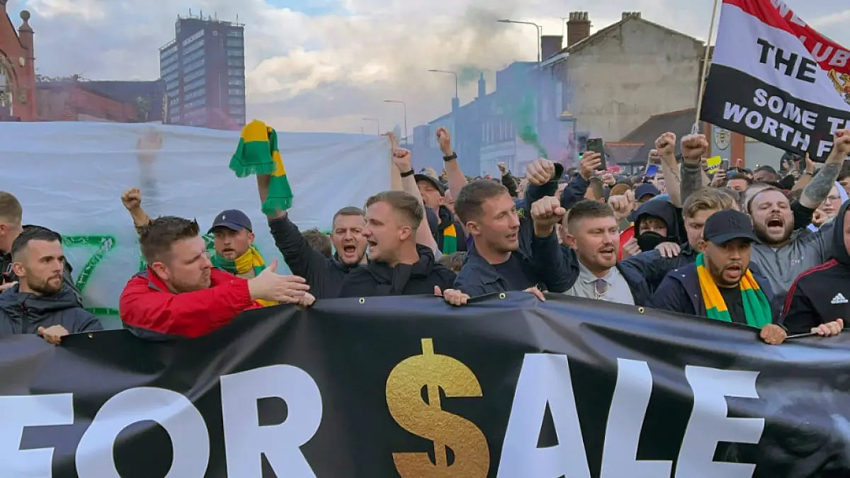 Manchester United fans protest ahead of their Premier League tie against Liverpool at Old Trafford.