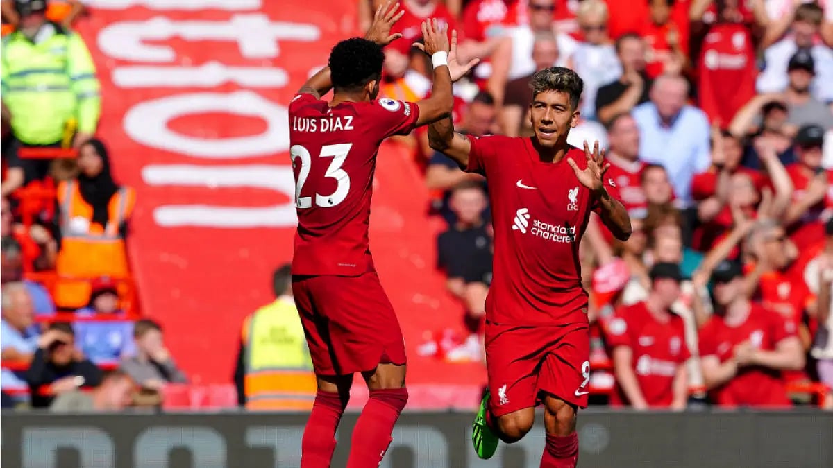 Liverpool's Roberto Firmino (R) celebrates with Luis Diaz after scoring against Bournemouth.