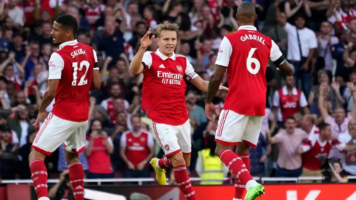 Arsenal players celebrate after scoring against Fulham in English Premier League 2022-23. 