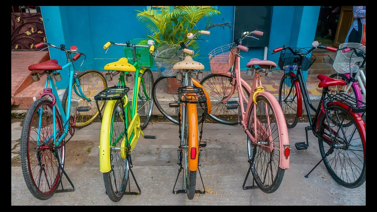 Brightly painted vintage bicycles along a lane in Puducherry