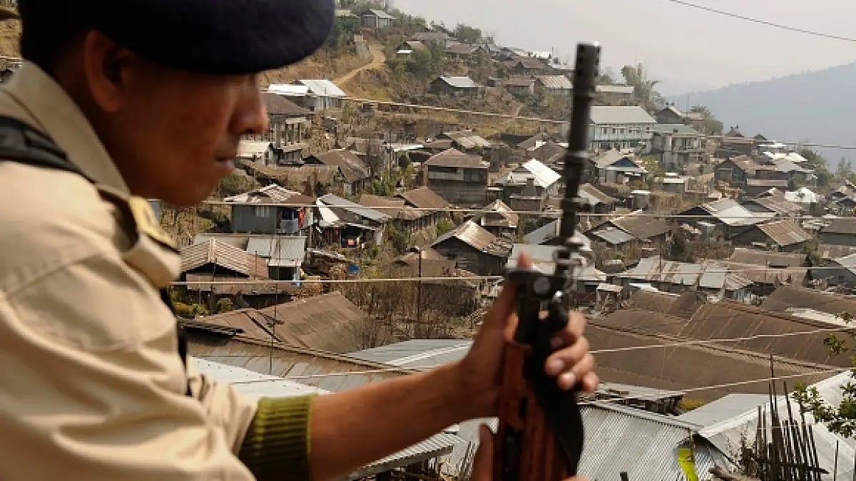 A security personnel keeps watch as campaigning progresses in Nagaland on February 21, 2018 in Kohim