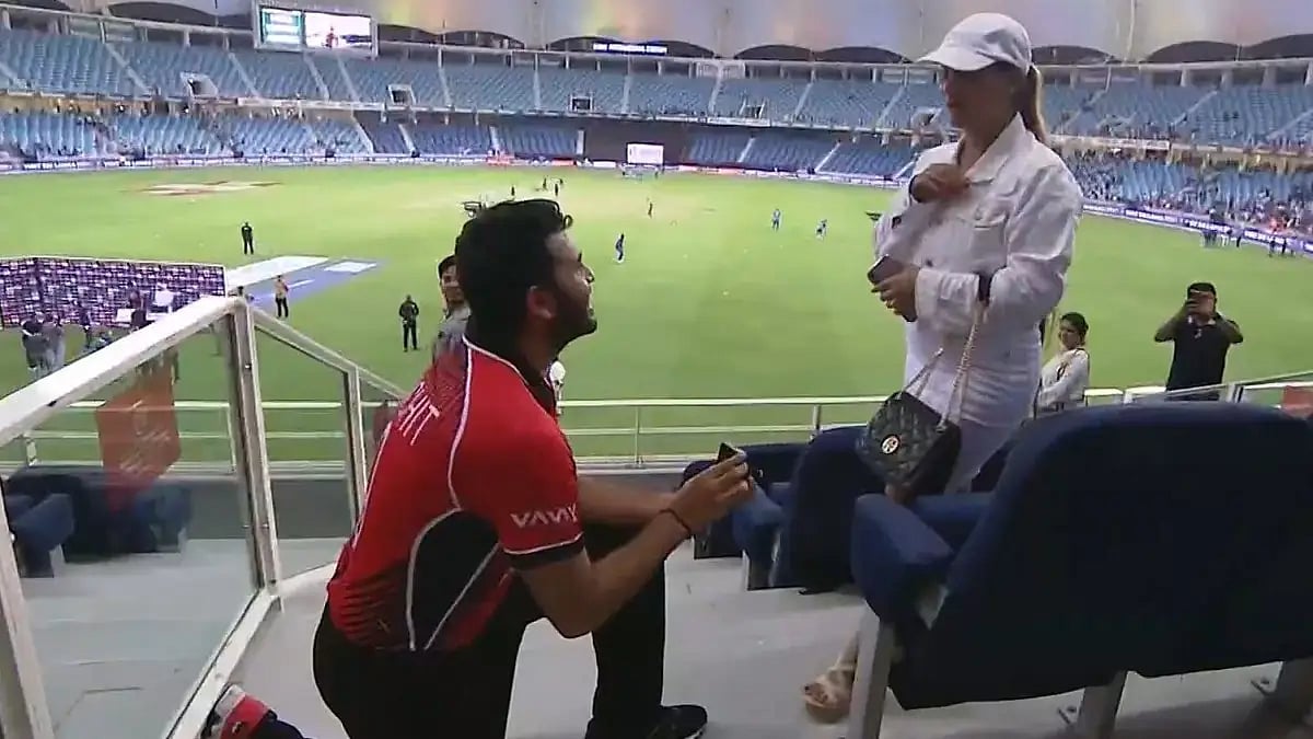 Hong Kong's Kinchit Shah proposes to his girlfriend at the Dubai International Stadium. 