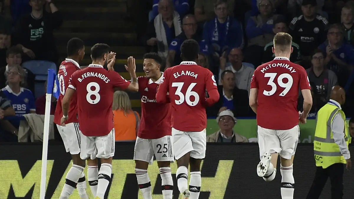 Manchester United's Jadon Sancho, center, celebrates a goal against Leicester City.