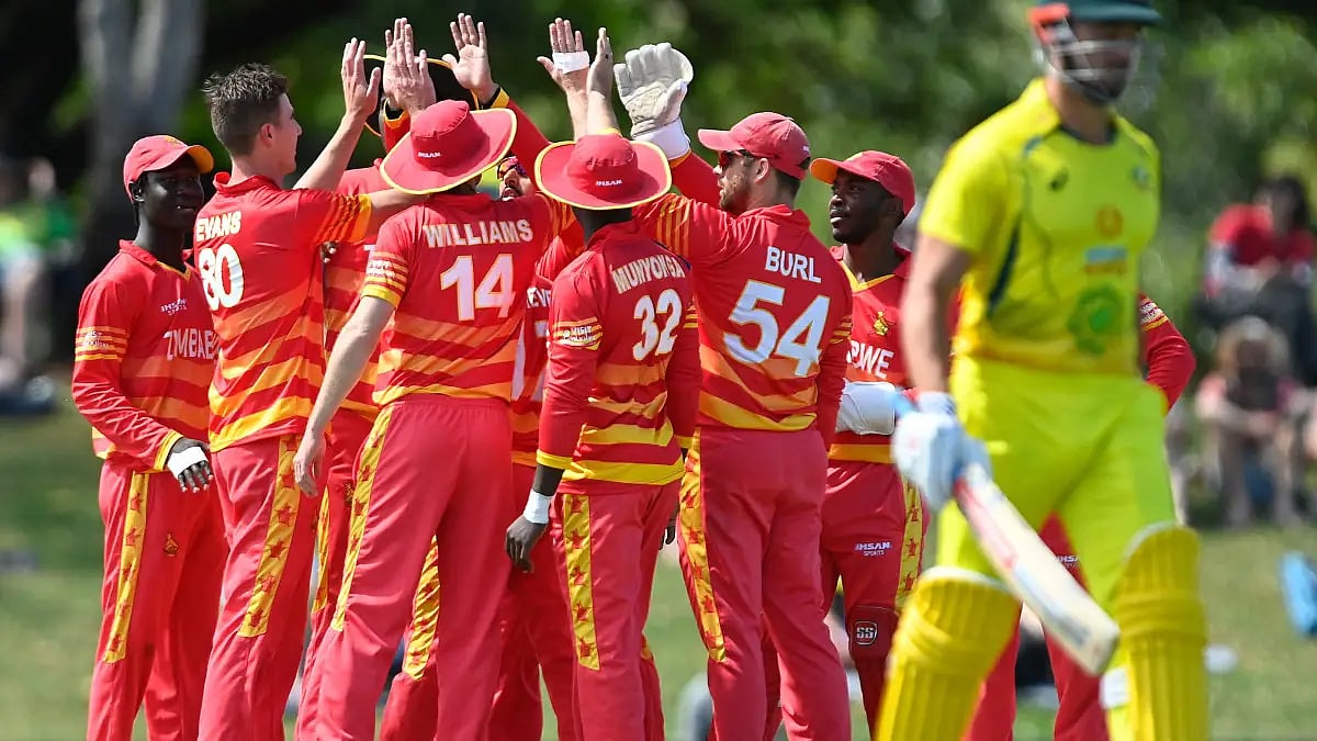 Zimbabwe players celebrate the fall of an Australian wicket in the third ODI.  