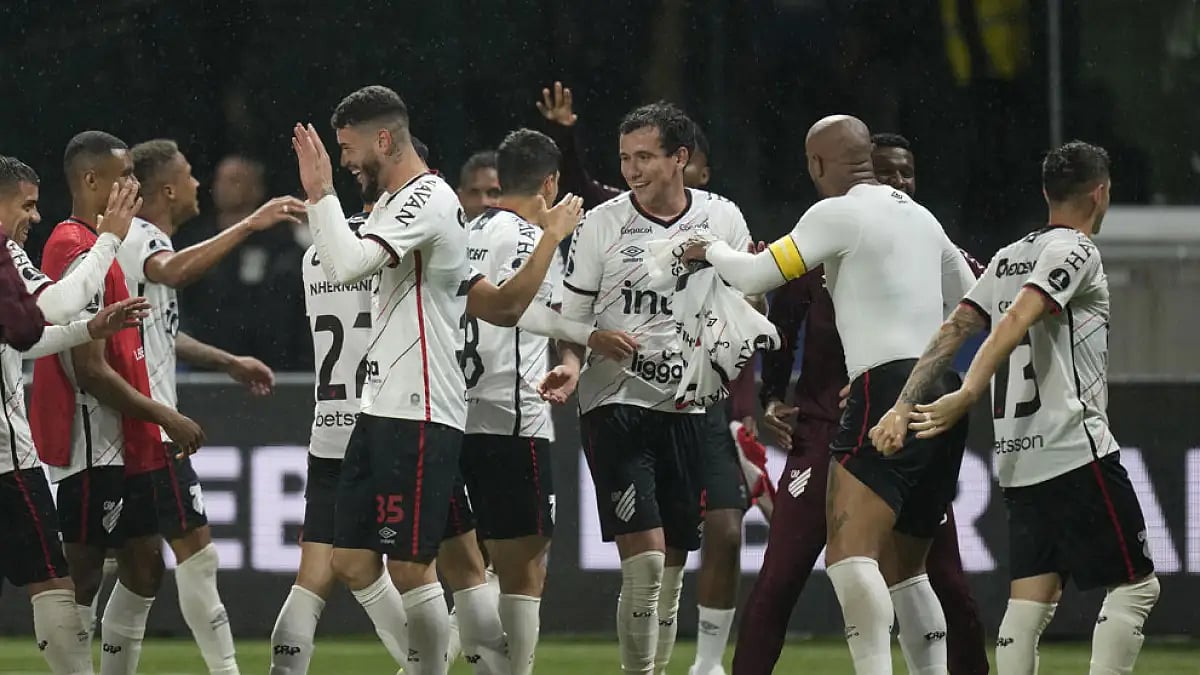 Athletico Paranaense players celebrate after beating Palmeiras.