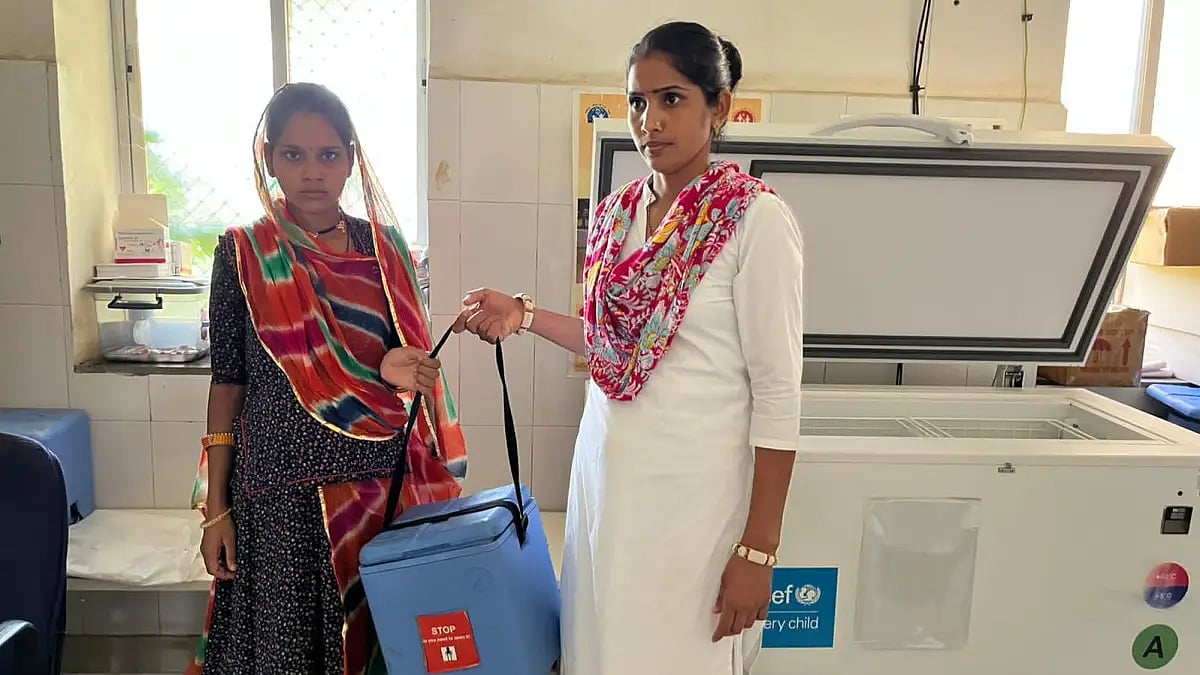 An ANM carrying vaccines stored at SDD at PHC in Vardara, Rajsamand district. 
