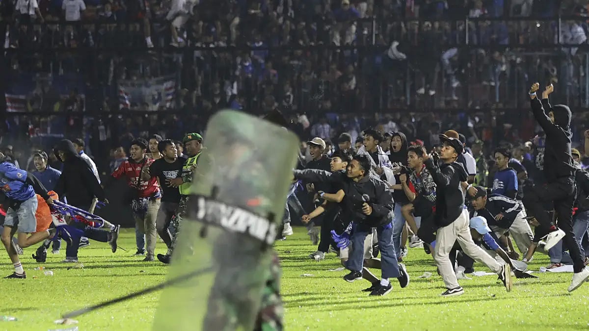 The stampede has claimed over 100 lives as fans and police collided on the field.