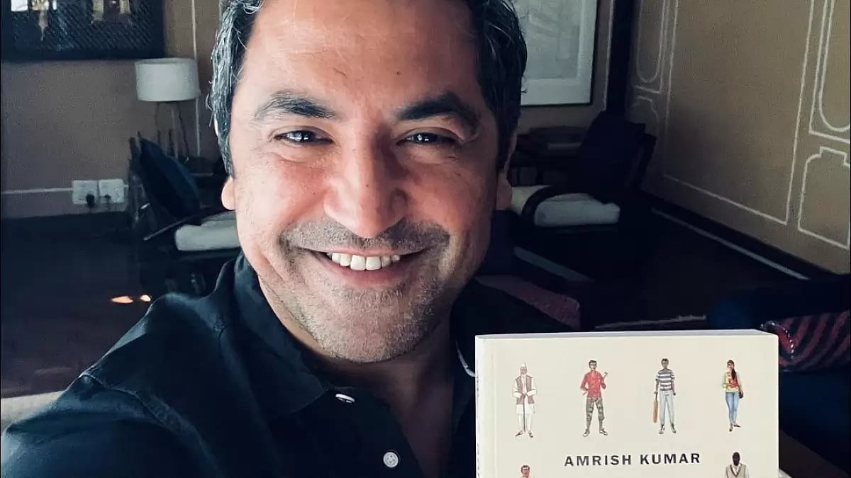 Amrish Kumar with his Book 