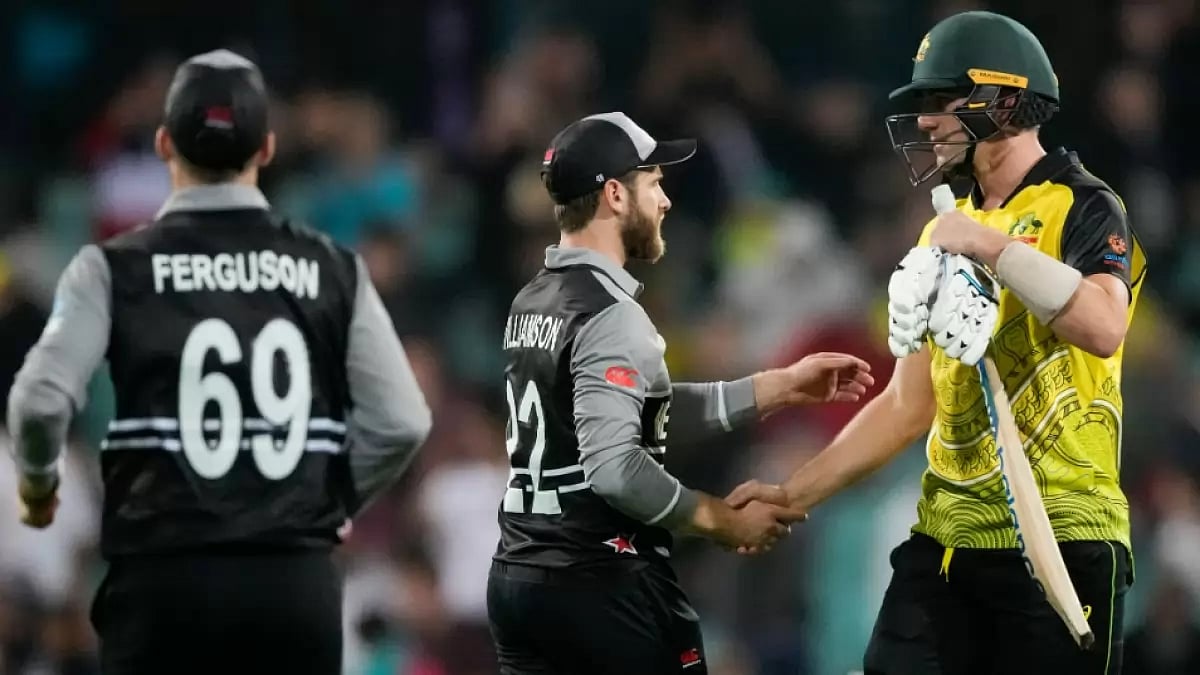 Kane Williamson shakes hands with Pat Cummins after New Zealand's win. Get AUS vs NZ highlights.