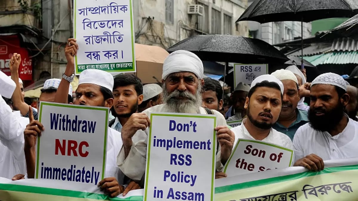 Members of Minority Youth Federation shout slogans during a rally against Assam's National Register 
