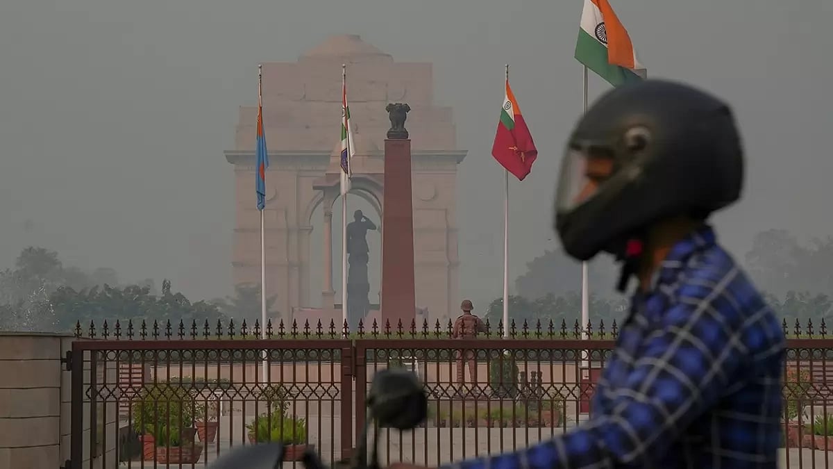 File Pic | : Man passing by India Gate in New Delhi |