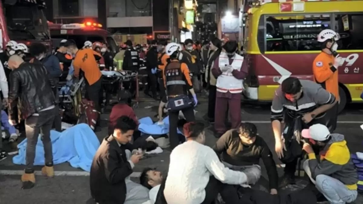 Rescue workers and firefighters try to help injured people near the scene in Seoul, South Korea