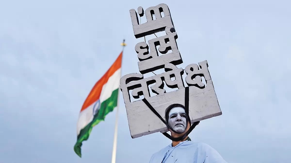 Secular Assertion: A man wears the artwork declaring “I am secular” 