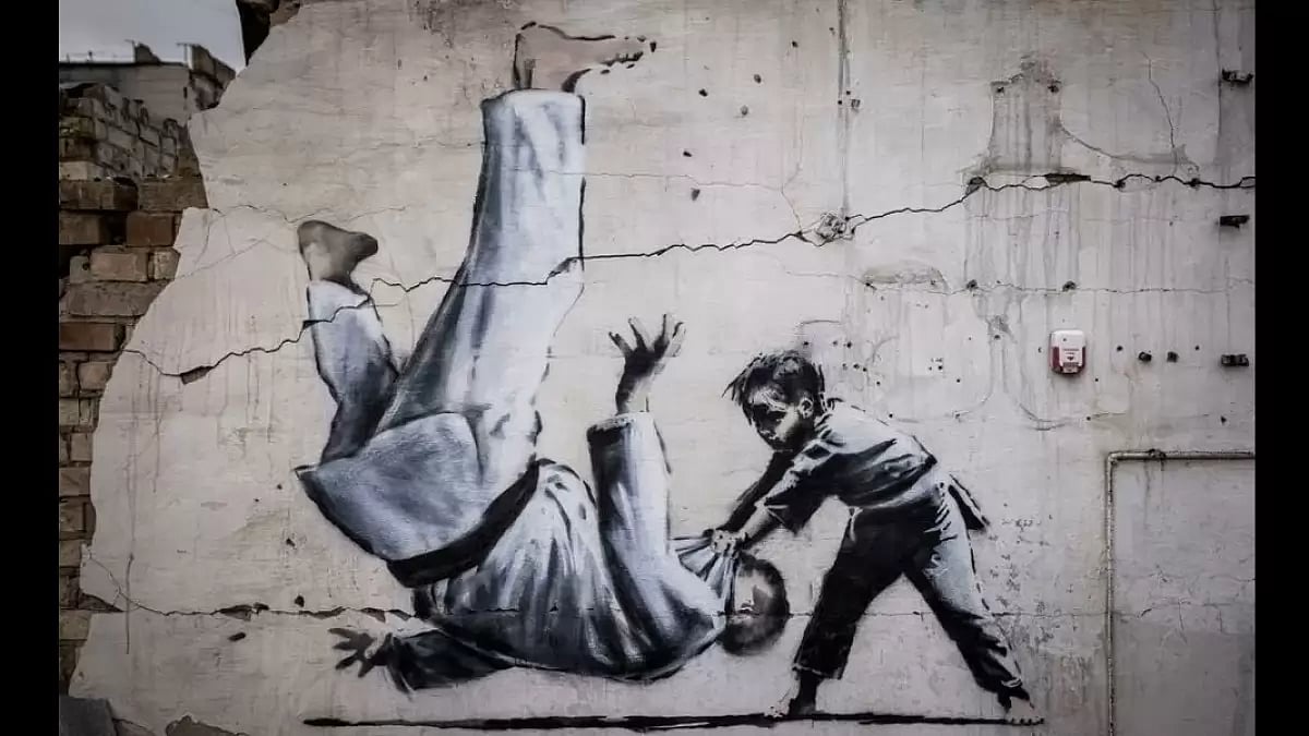 Banksy unveils Ukraine gymnast mural on building shelled by Russia