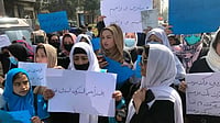 Explained: What The Taliban Regime Means By Calling For Full Implementation Of Islamic Law? Afghan women chant and hold signs while staging a protest in Kabul