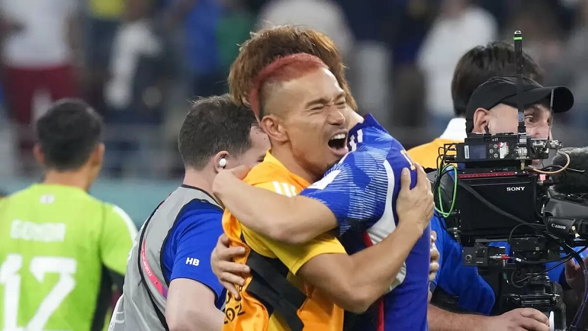 Japan players celebrate their team's win over Germany.