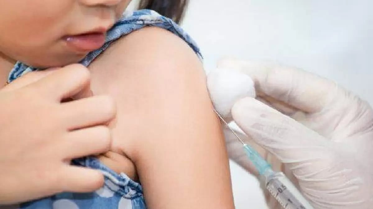 A child being given a vaccine.