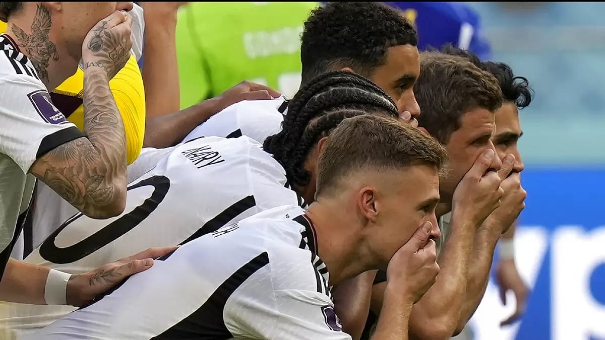 German players were seen covering their mouths as a sign of protest before match against Japan.