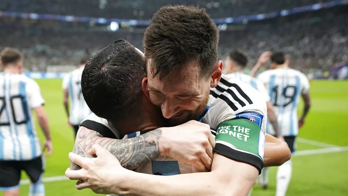 Lionel Messi celebrates his goal with teammate Angel Di Maria.