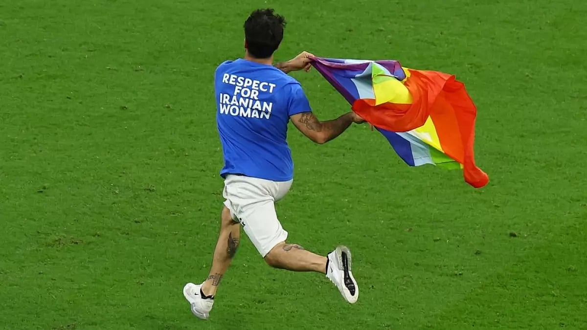 A protester stormed the pitch with a rainbow flag at the Portugal Vs Uruguay game.
