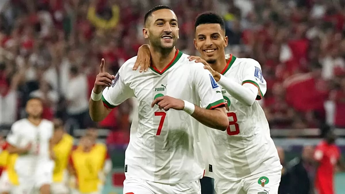 Ziyech celebrates with teammate Azzedine Ounahiafter after scoring the opening goal for Morocco.