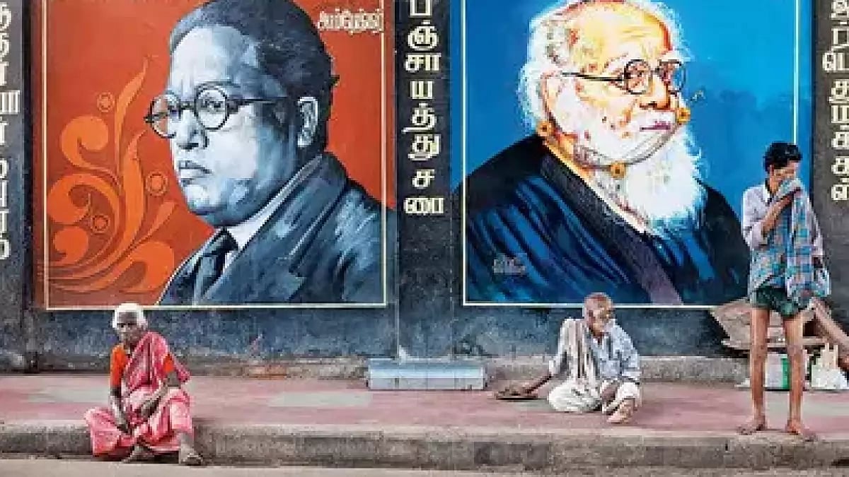 Dalits in Tamil Nadu sit before wall paintings of Ambedkar and Periyar (Representative image)
