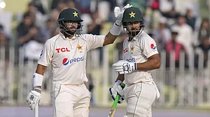 Pakistan's Imam-ul-Haq congratulates Shafique after the latter reached his half-century.