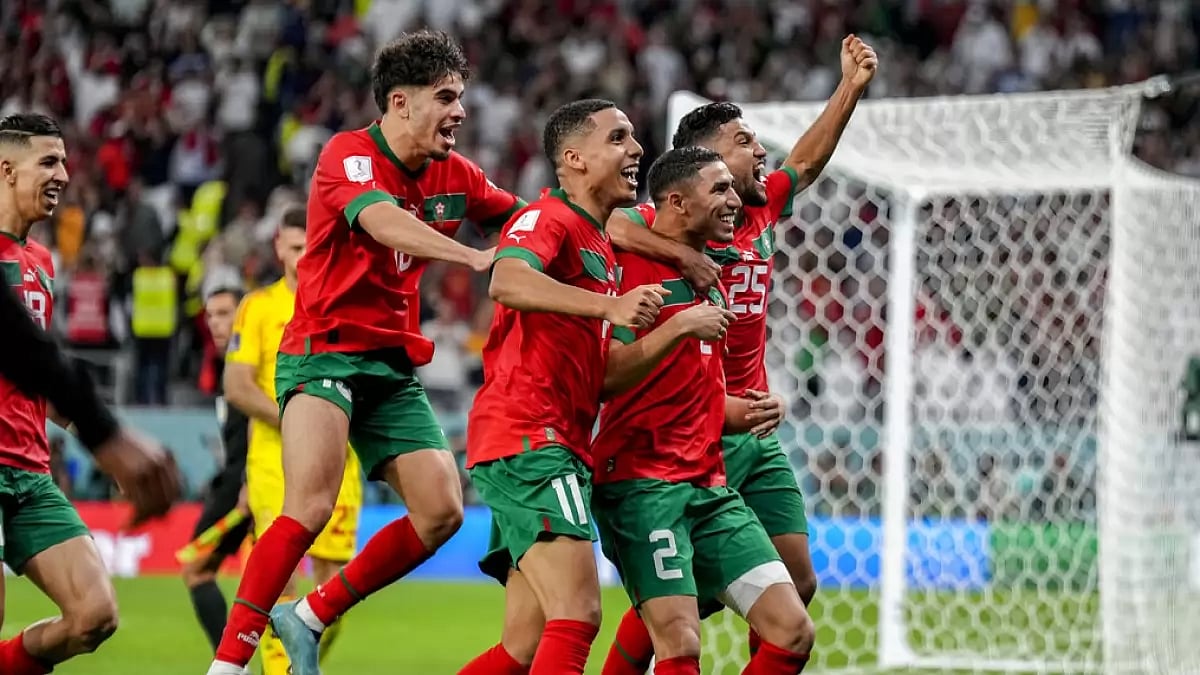 Morocco players celebrate after winning the penalty shootout against Spain on Tuesday.