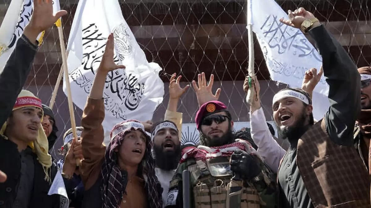 Taliban fighters chant slogans.