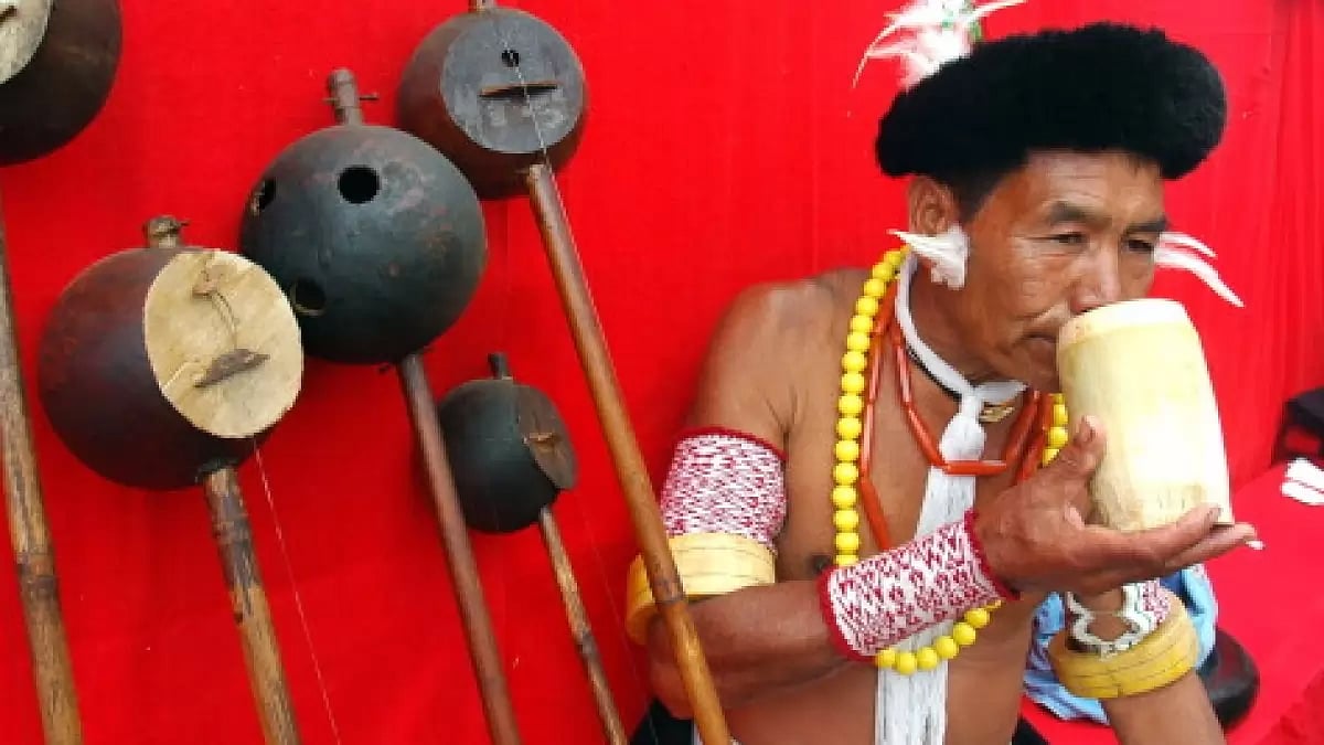 A man from the ethnic Angami community drinking from wooden glass at the Hornibill festival.